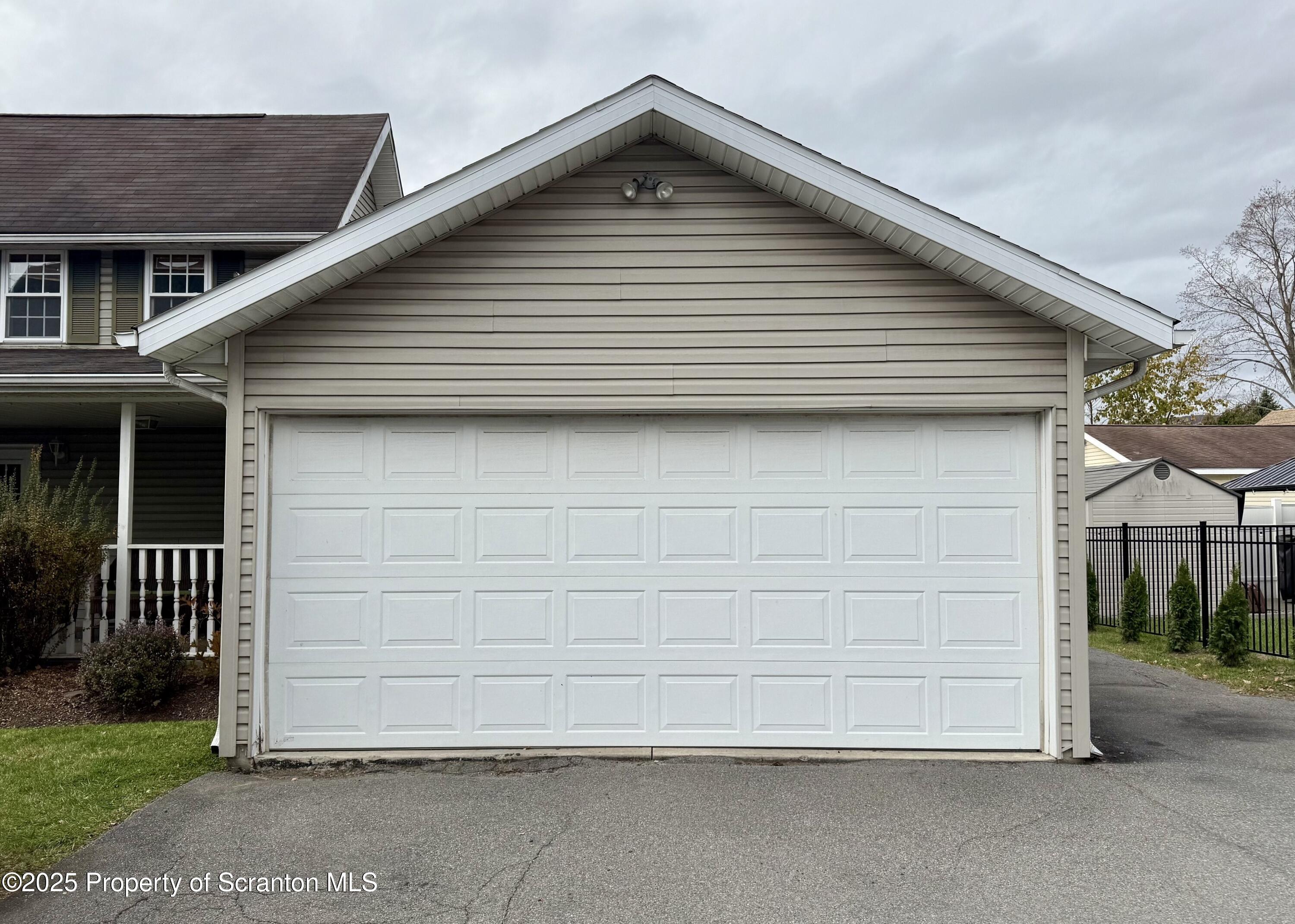 302 Main Street Blakely, PA 18452 - Photo 7 of 38 a view of a house with garage