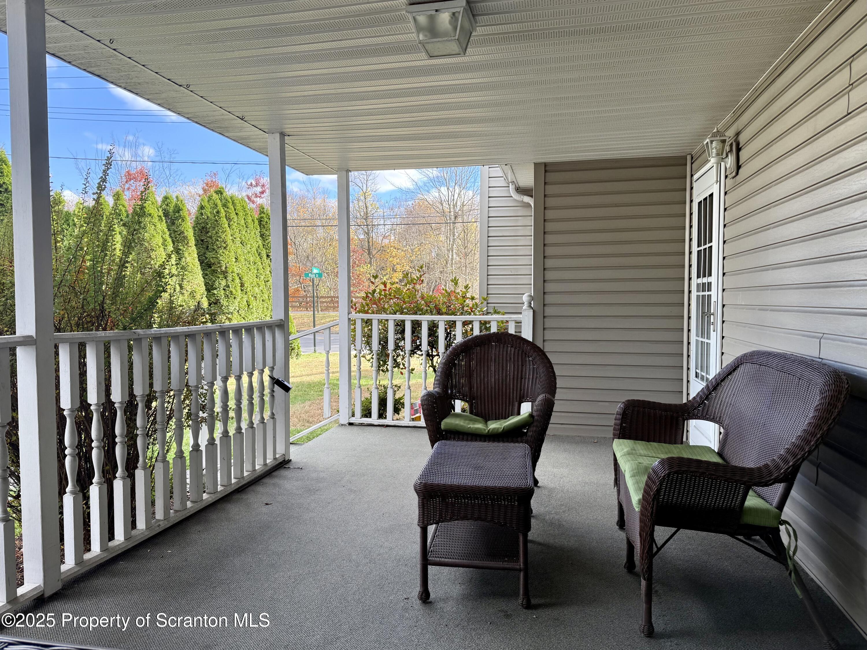 302 Main Street Blakely, PA 18452 - Photo 10 of 38 a view of a chairs and table in patio