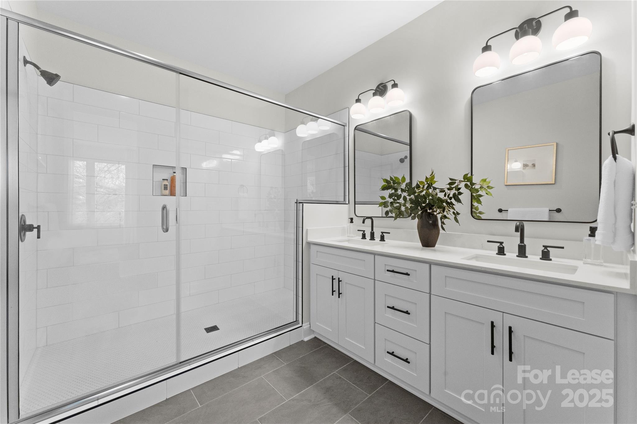 3236 Riley Avenue Charlotte, NC 28269 - Photo 12 of 19 a bathroom with a double vanity sink mirror and shower