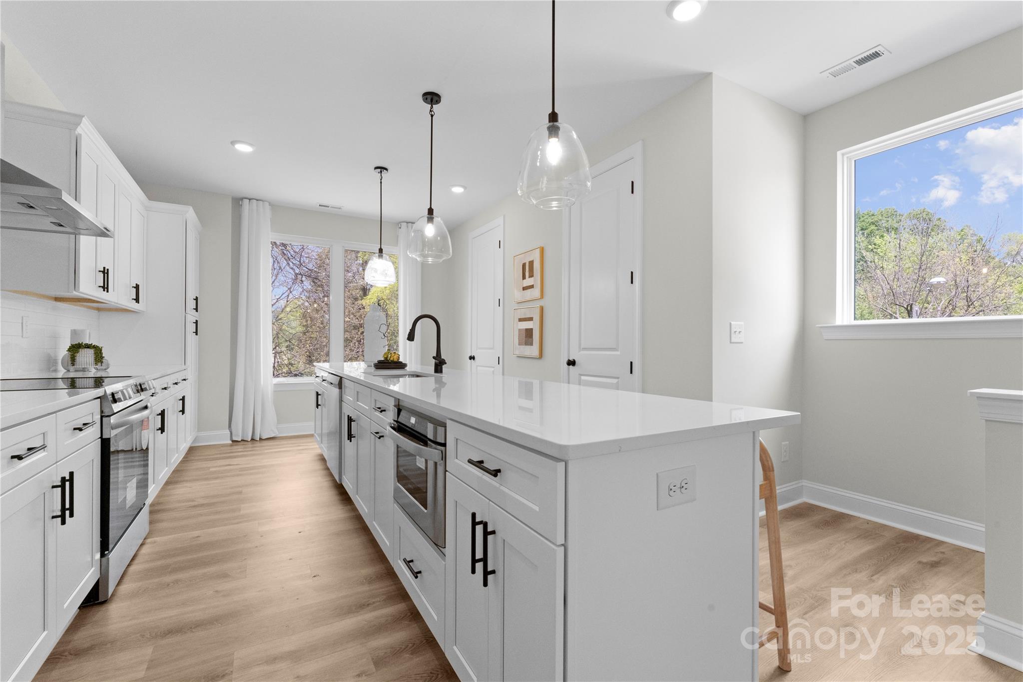 3236 Riley Avenue Charlotte, NC 28269 - Photo 5 of 19 a large kitchen with stainless steel appliances lots of counter space sink and a window