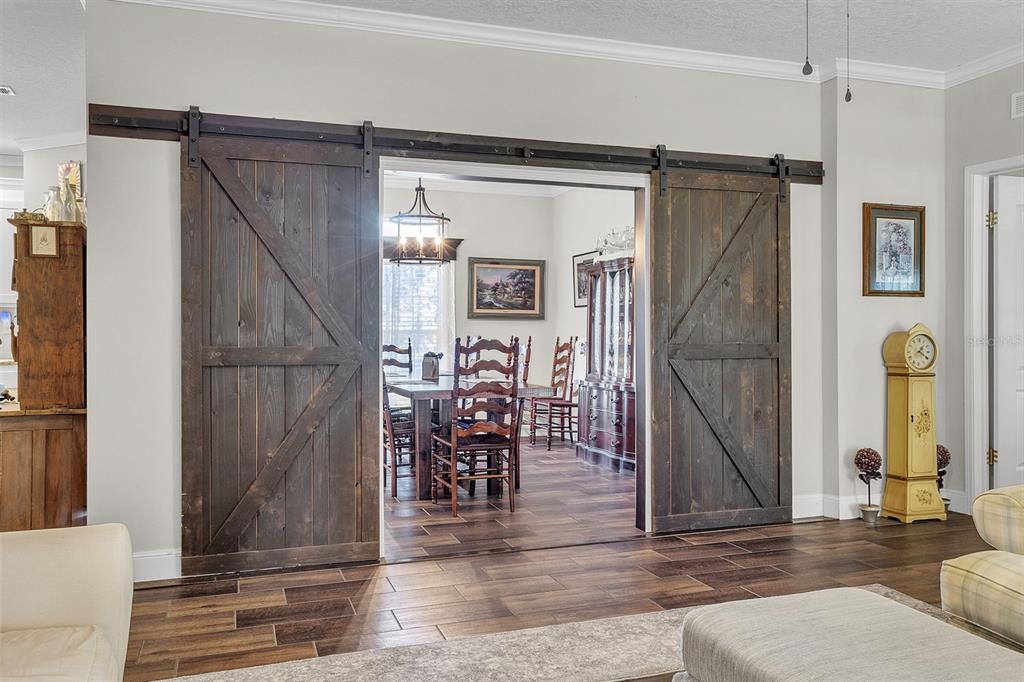 601 Purvis Road Seville, FL 32190 - Photo 8 of 29 a view of entryway and hall with wooden floor