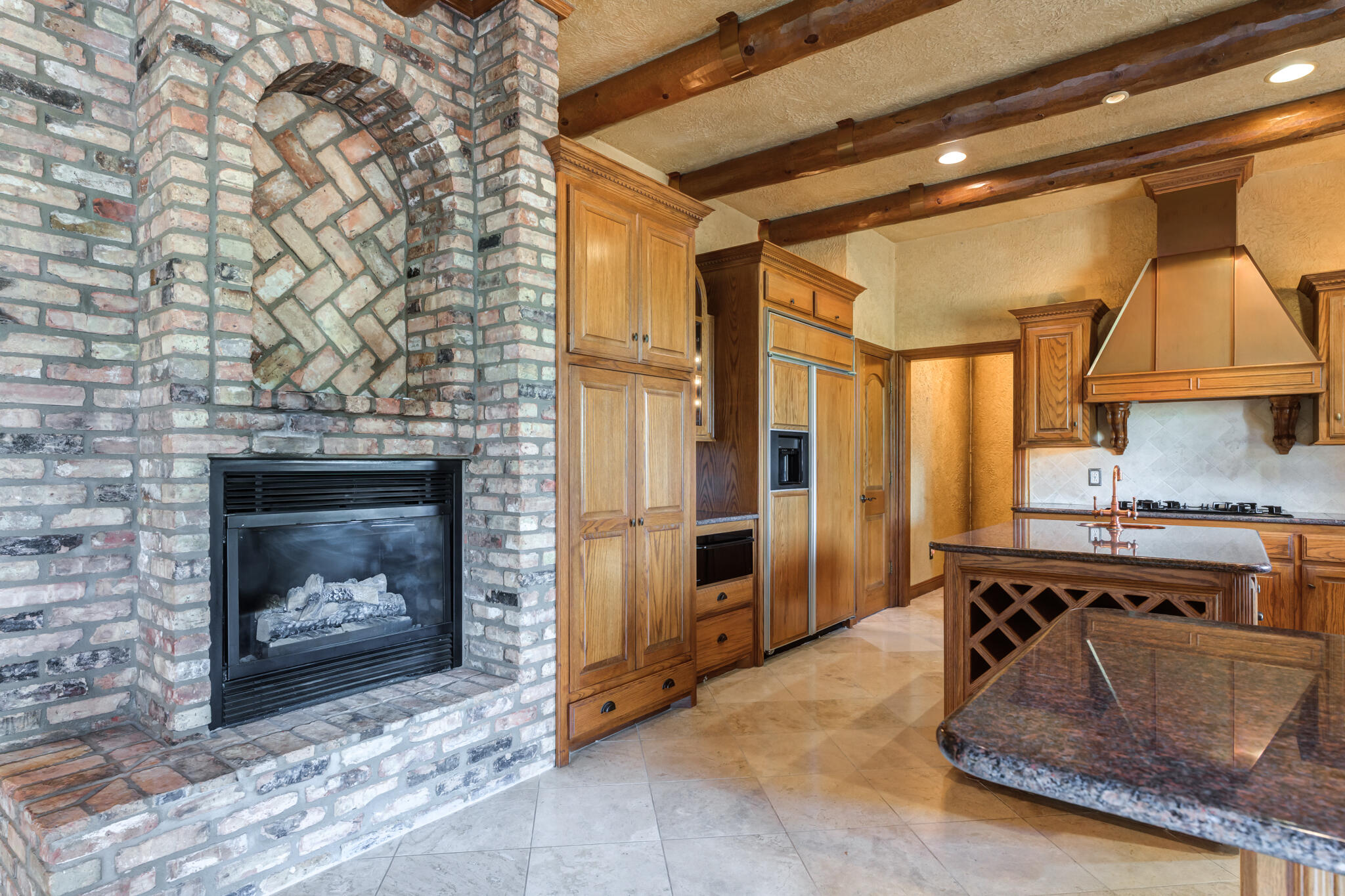 8901 York Place Lubbock, TX 79424 - Photo 12 of 45 a kitchen with a fireplace and a stove