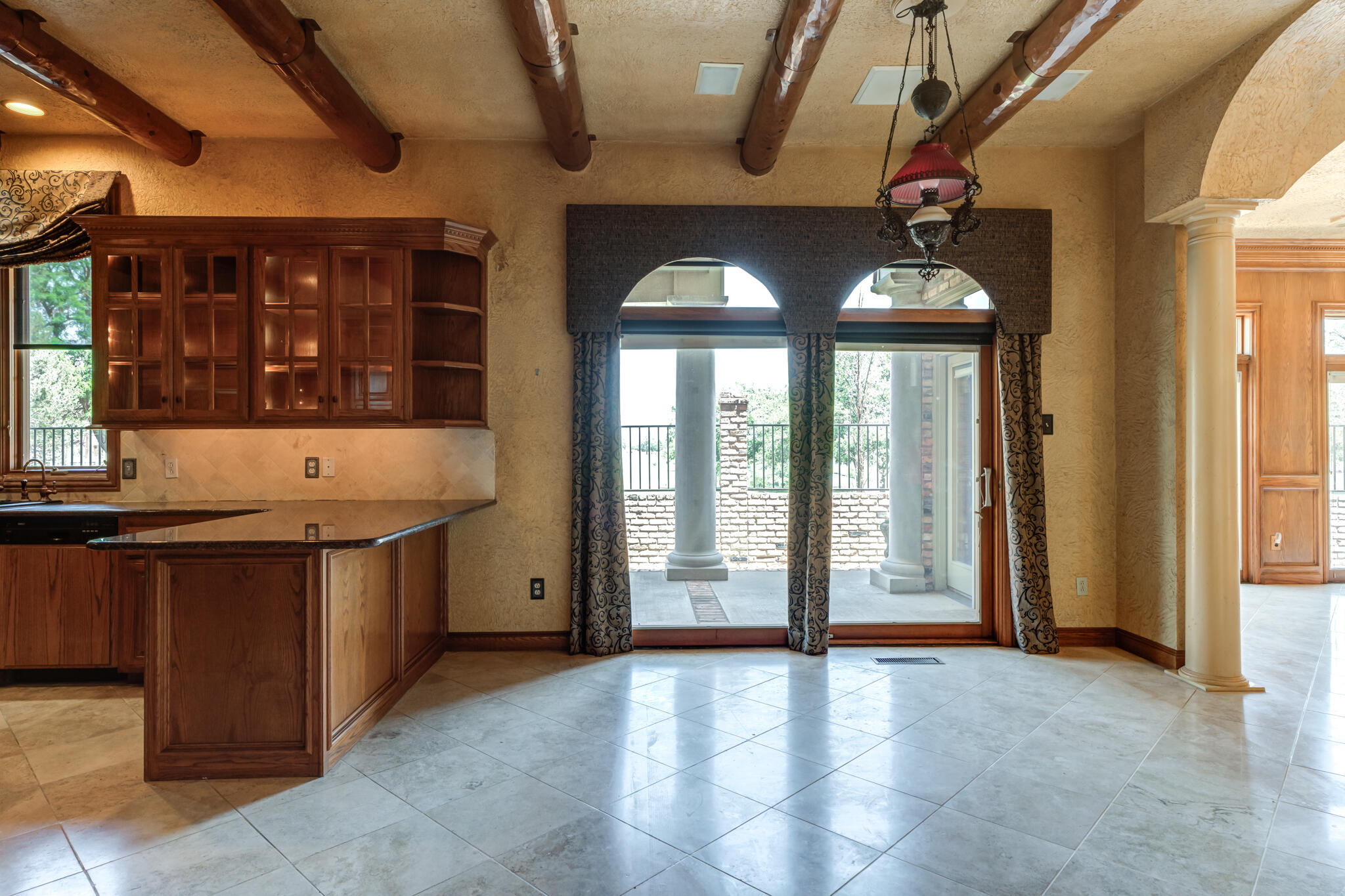 8901 York Place Lubbock, TX 79424 - Photo 16 of 45 a view of a kitchen with a sink and large windows