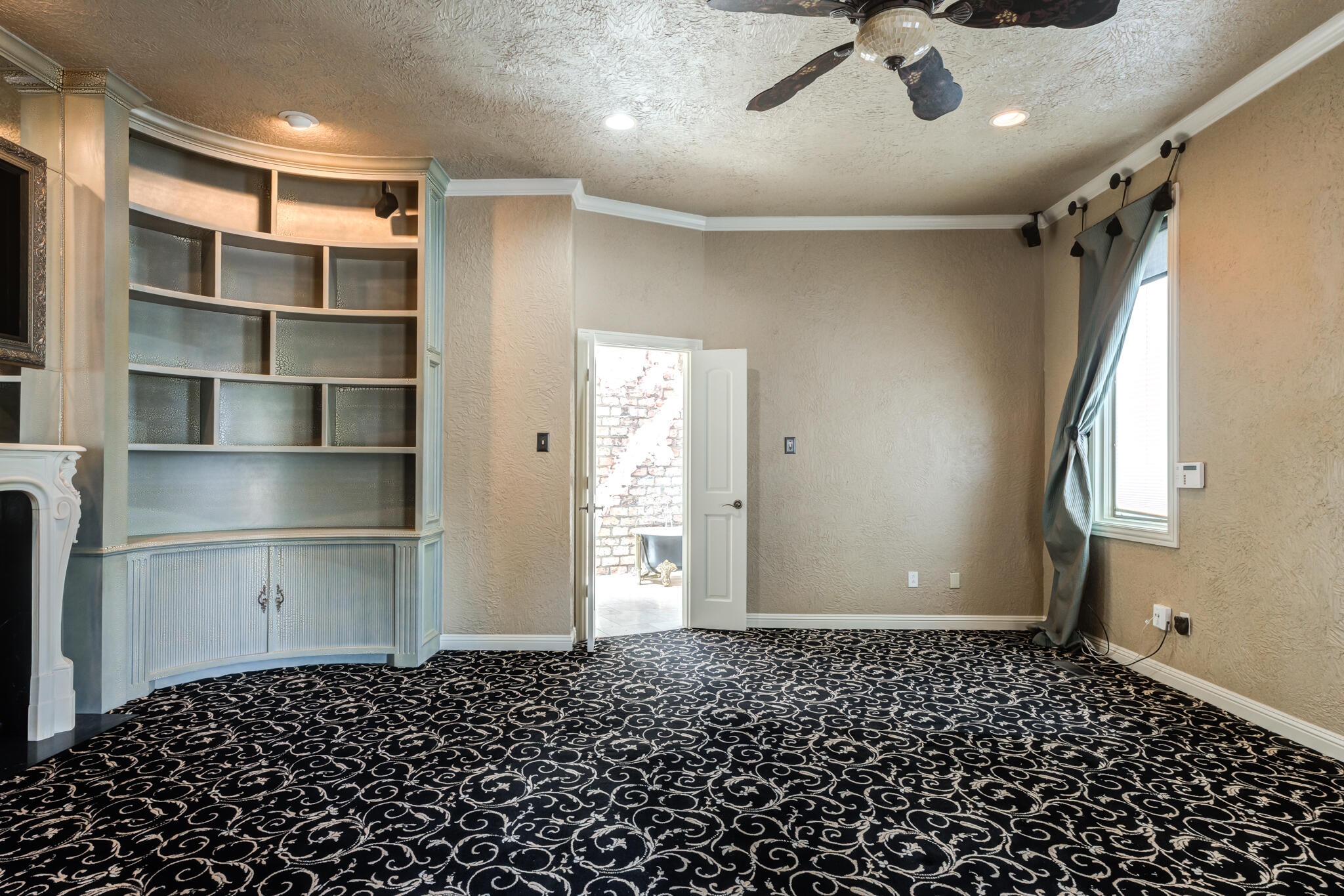 8901 York Place Lubbock, TX 79424 - Photo 23 of 45 a bathroom with a black and white checkered floor