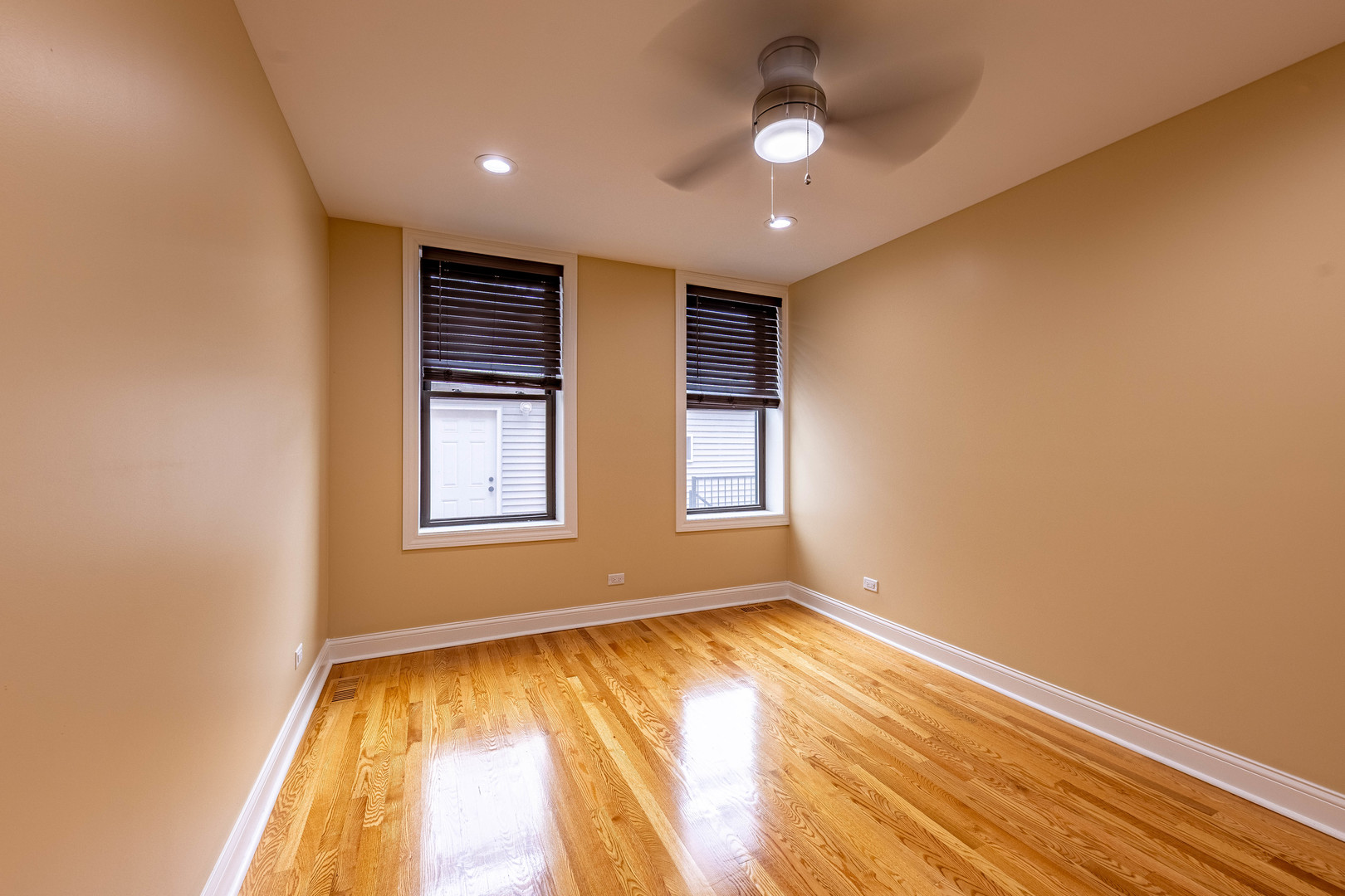 2012 West Coulter Street Chicago, IL 60608 - Photo 14 of 47 a view of empty room with wooden floor and fan