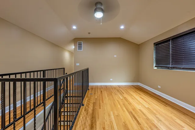 a view of hallway with wooden floor