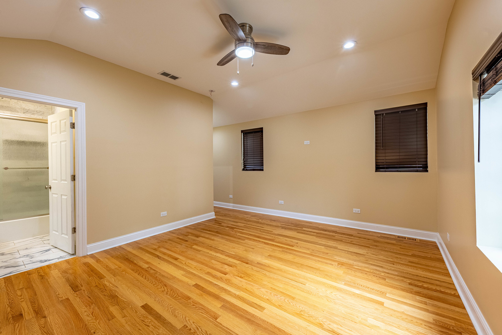 2012 West Coulter Street Chicago, IL 60608 - Photo 27 of 47 a view of an empty room with wooden floor and a window