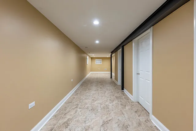 a view of an empty room and a window