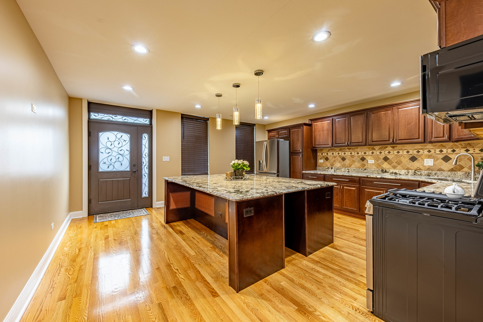 2012 West Coulter Street Chicago, IL 60608 - Photo 4 of 47 a kitchen with a stove and a microwave
