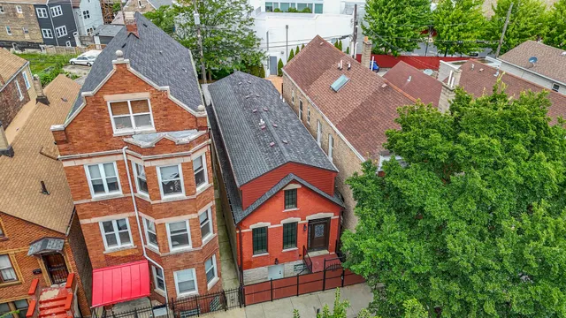 an aerial view of residential houses with outdoor space