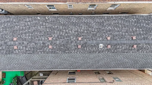 an aerial view of a house with wooden floor