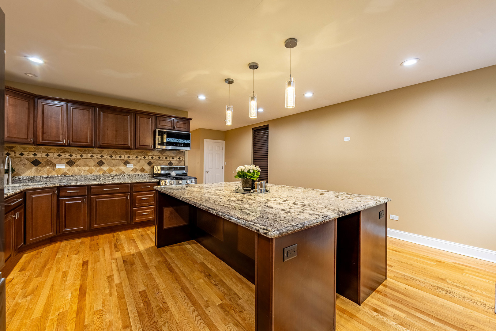2012 West Coulter Street Chicago, IL 60608 - Photo 7 of 47 a kitchen with stainless steel appliances granite countertop a kitchen island a stove and a sink