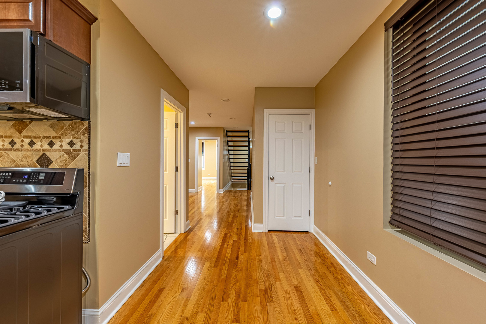 2012 West Coulter Street Chicago, IL 60608 - Photo 10 of 47 a view of a hallway with wooden floor and staircase