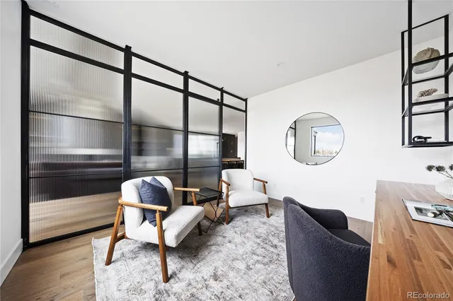a room with a sink cabinets and appliances