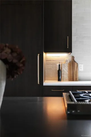 a living room with couches a coffee table and a large window with outer view