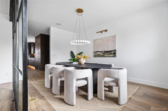 a living room with furniture ceiling fan and a rug
