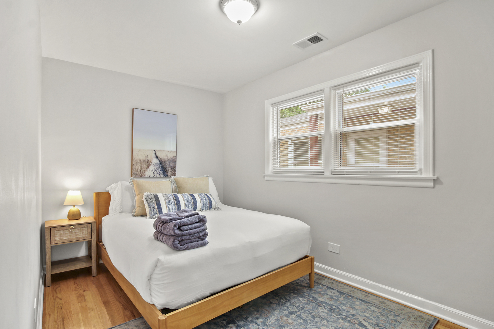 236 Callan Avenue, Unit 3 Evanston, IL 60202 - Photo 11 of 15 a bedroom with a bed and a table