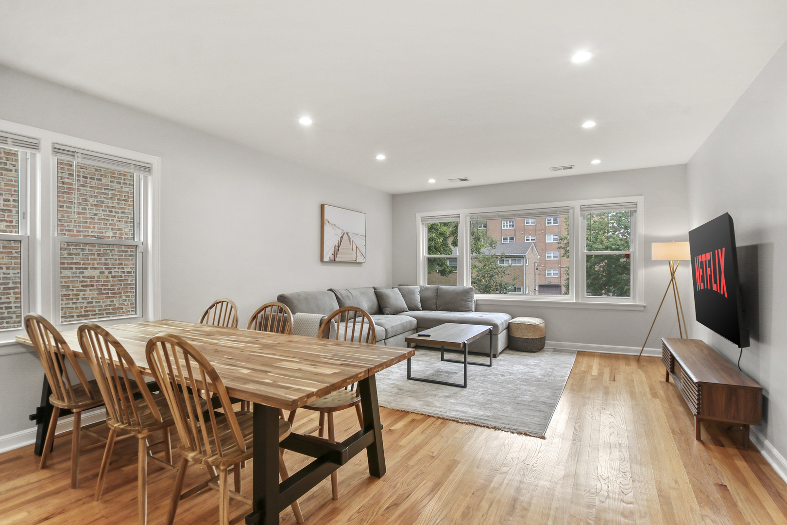 236 Callan Avenue, Unit 3 Evanston, IL 60202 - Photo 7 of 15 a view of a dining room with furniture window and wooden floor