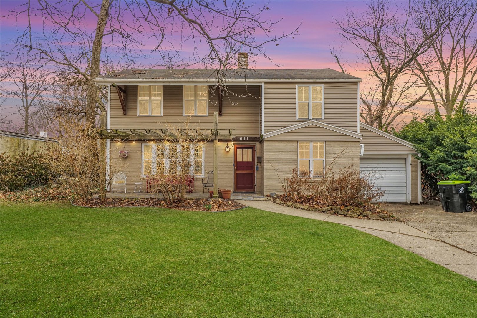 911 Foley Avenue Champaign, IL 61820 - Photo 1 of 33 a front view of a house with a garden