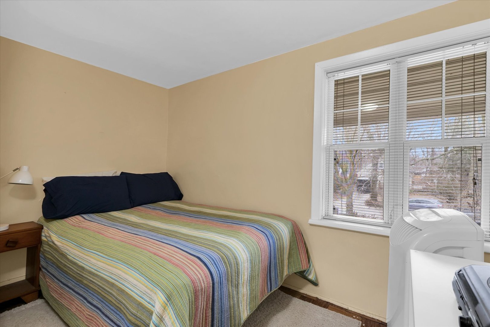 911 Foley Avenue Champaign, IL 61820 - Photo 27 of 33 a bedroom with a bed and a large window