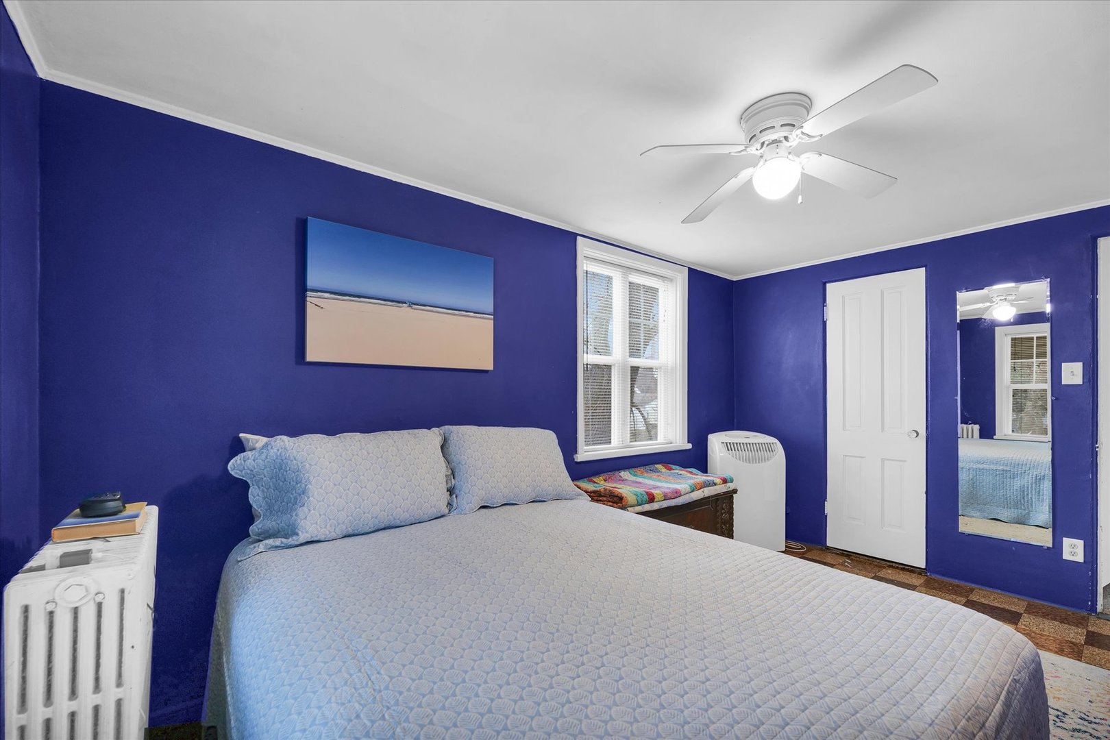 911 Foley Avenue Champaign, IL 61820 - Photo 30 of 33 a bedroom with a bed and wooden floor