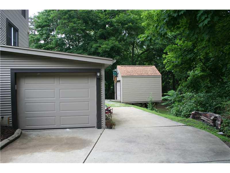 880 Tuscarawas Road Beaver, PA 15009 - Photo 5 of 20 Parking Lot/Garage. ATTACHED GARAGE WITH STORAGE! NOTICE THE NICE PATIO ON THE RIGHT!