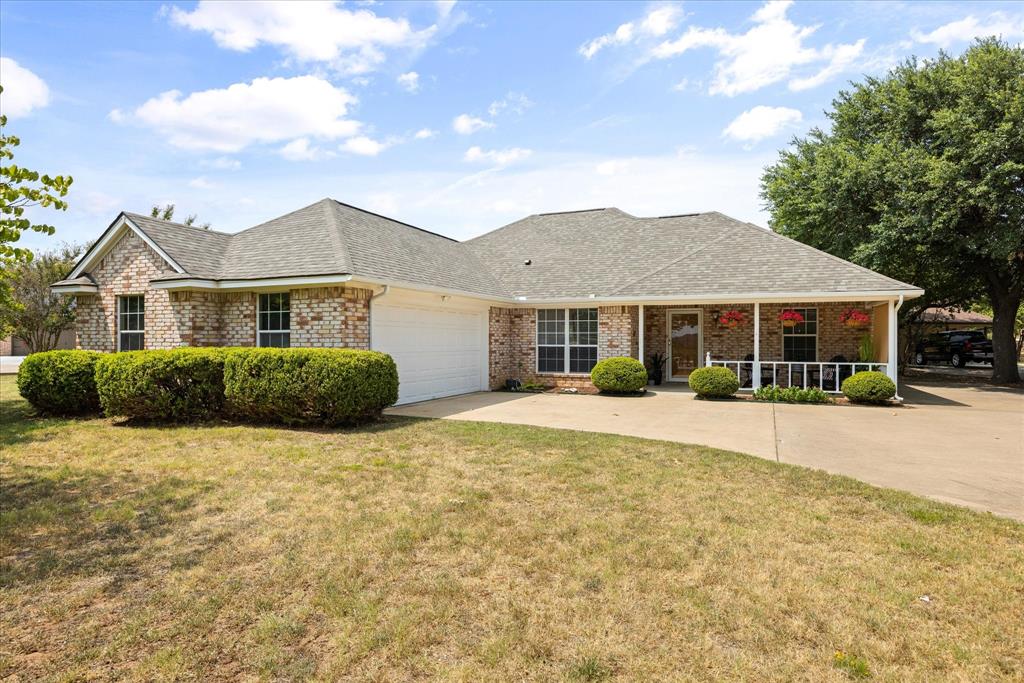 10519 Ravenswood Road Granbury, TX 76049 - Photo 2 of 40 2 car garage plus a golf cart garage in the back