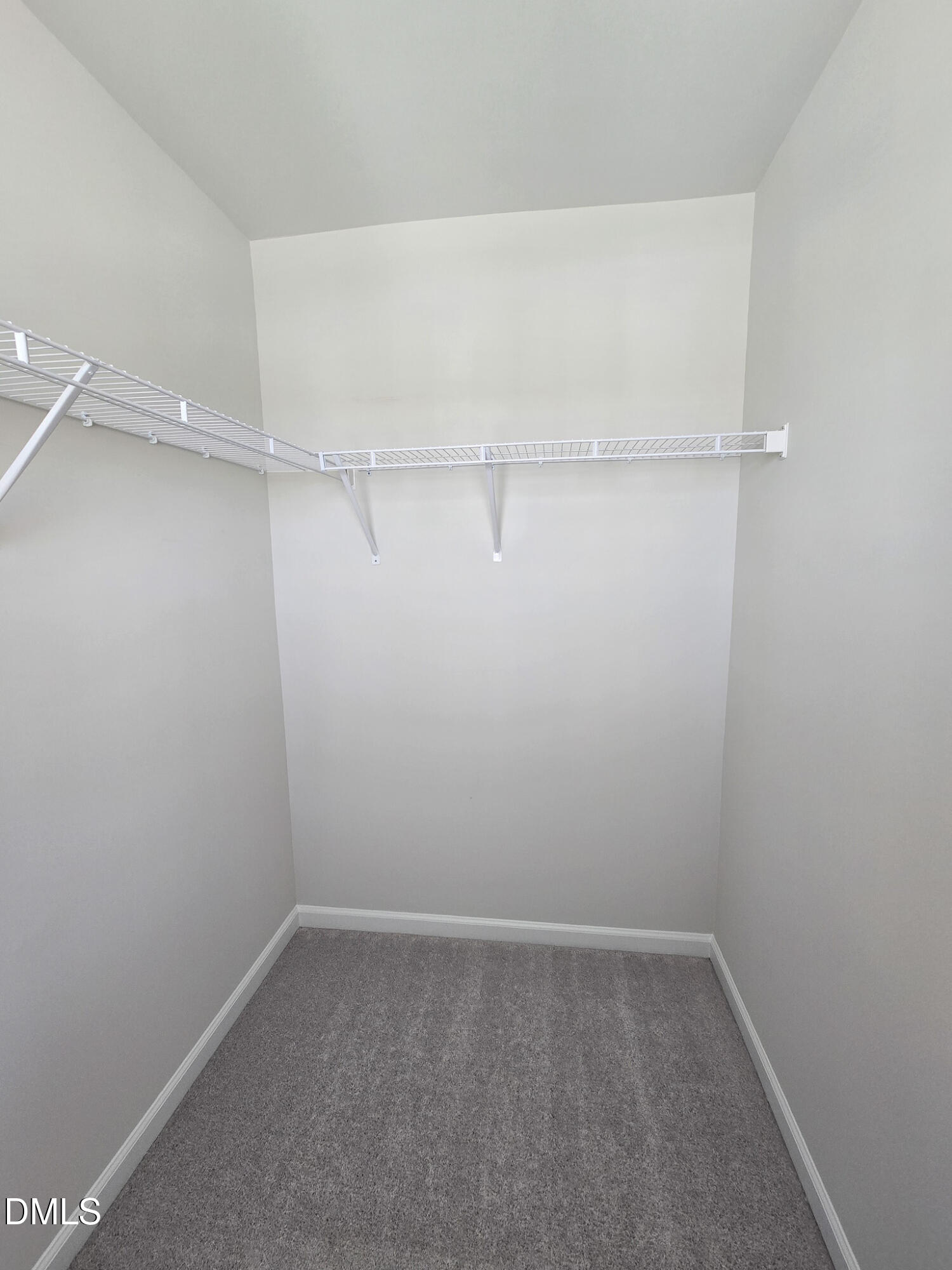 2431 Kasota Lane Raleigh, NC 27610 - Photo 41 of 46 a empty walk in closet room with a small window