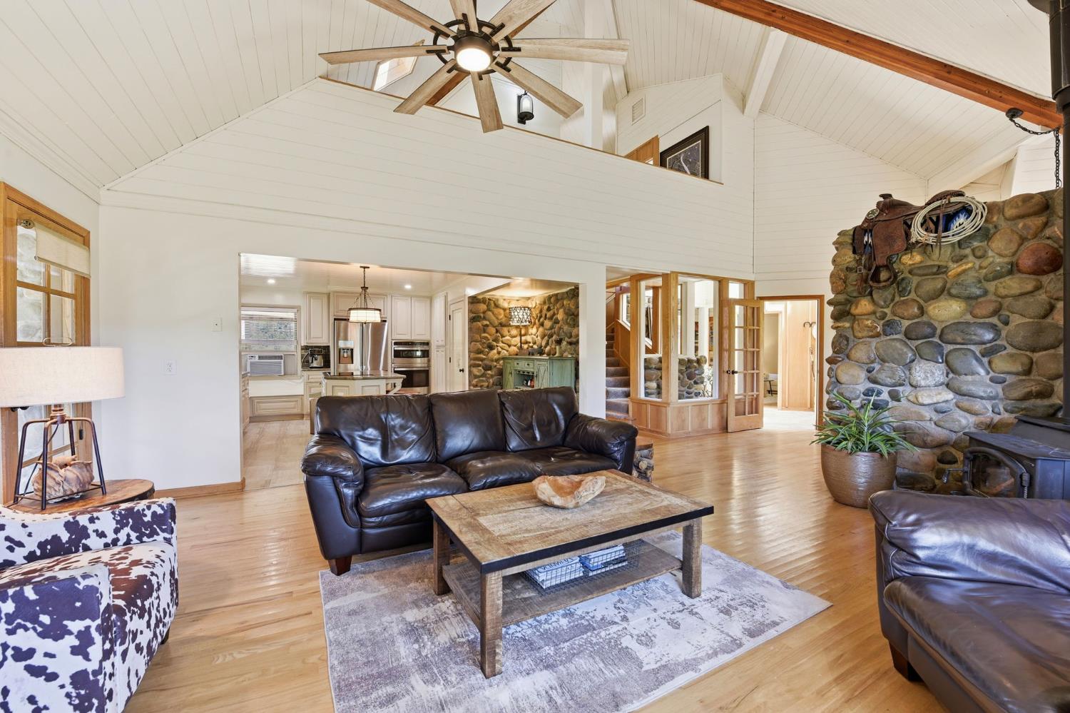 7201 Happy Valley Road Somerset, CA 95684 - Photo 14 of 75 The upper story has an open loft-like hallway that opens up to the living room, allowing heat from the wood stove to circulate throughout the bedrooms and loft office area.