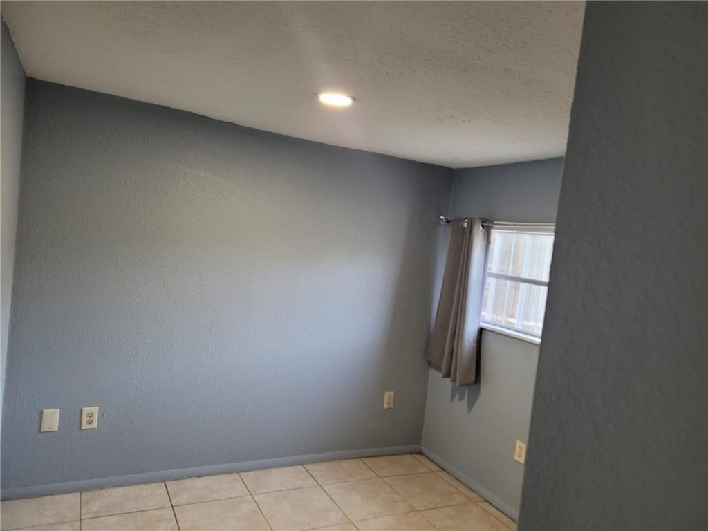 10482 Marina Way Boca Raton, FL 33428 - Photo 14 of 16 an empty room with windows