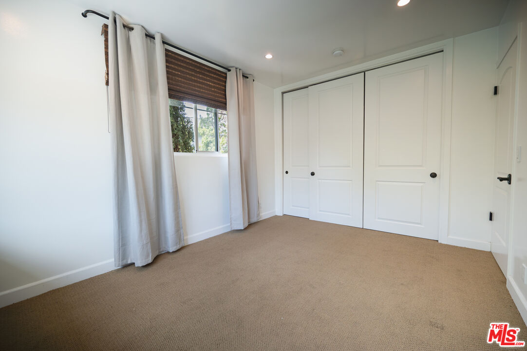 503 North Greencraig Road Los Angeles, CA 90049 - Photo 29 of 59 a view of an empty room with a window