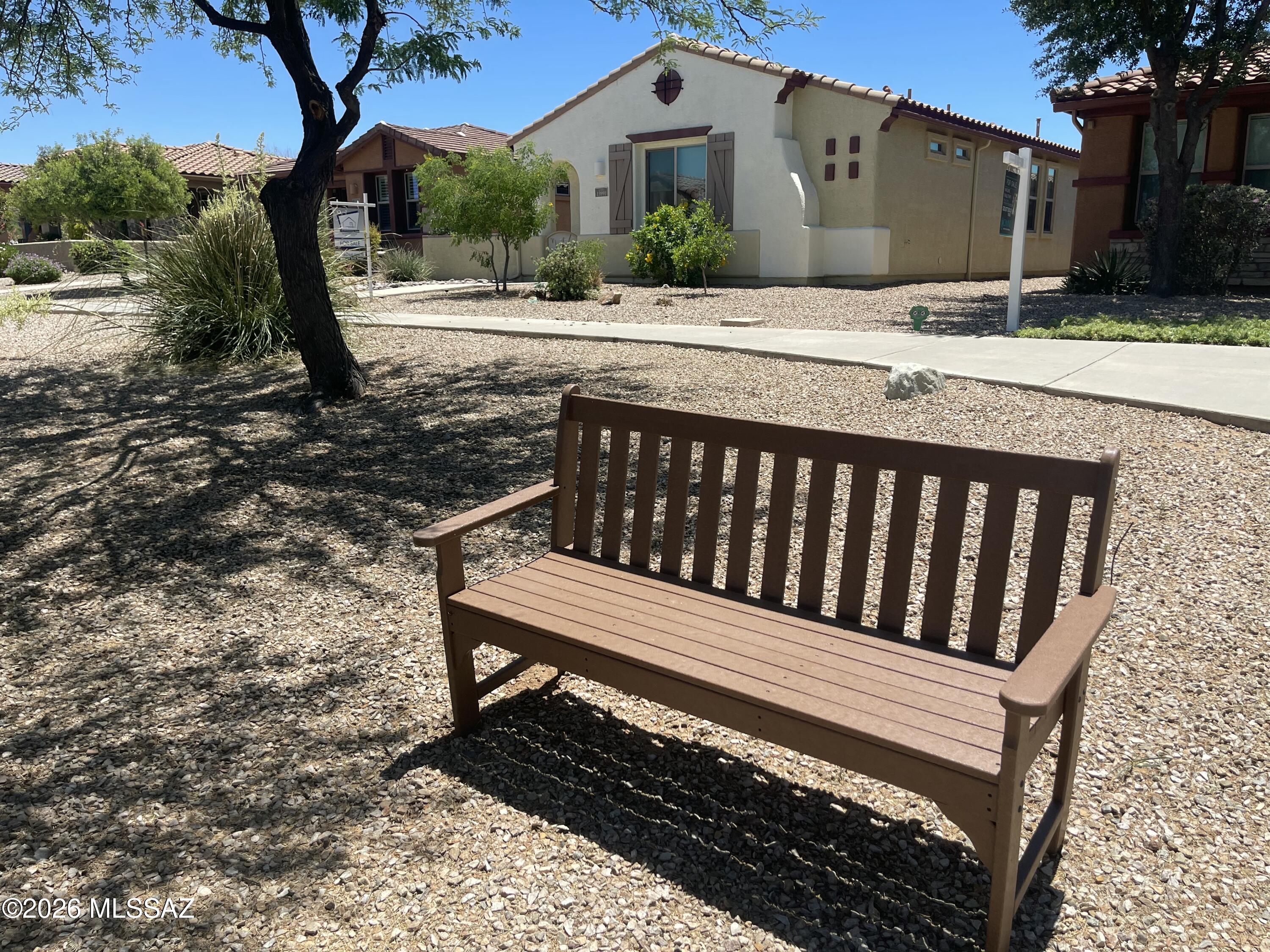 13991 East Cheavront Loop Vail, AZ 85641 - Photo 36 of 47 a view of a bench in backyard of house