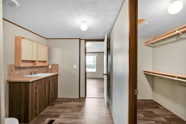 a bathroom with a sink a mirror and a shower