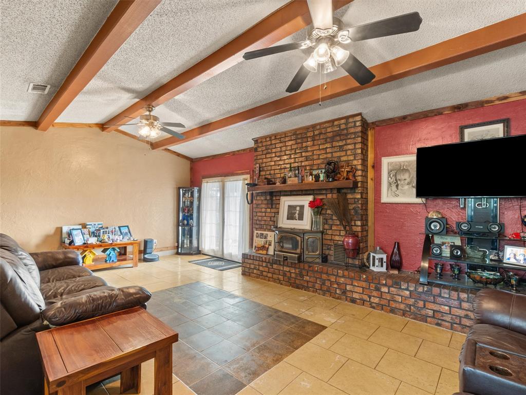 571 County Road Daingerfield, TX 75638 - Photo 19 of 34 a living room with furniture and a flat screen tv