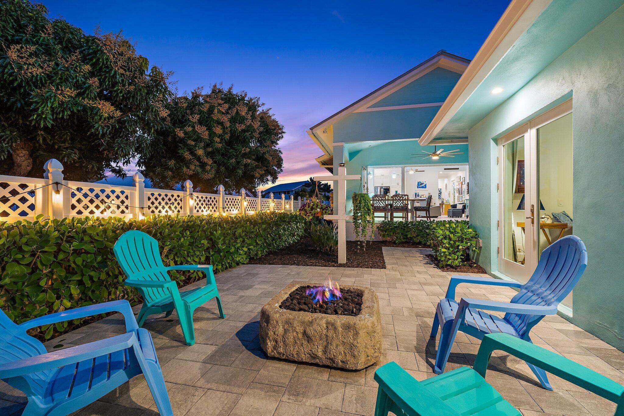 3443 Inlet Court Jupiter, FL 33469 - Photo 11 of 59 a backyard of a house with outdoor seating