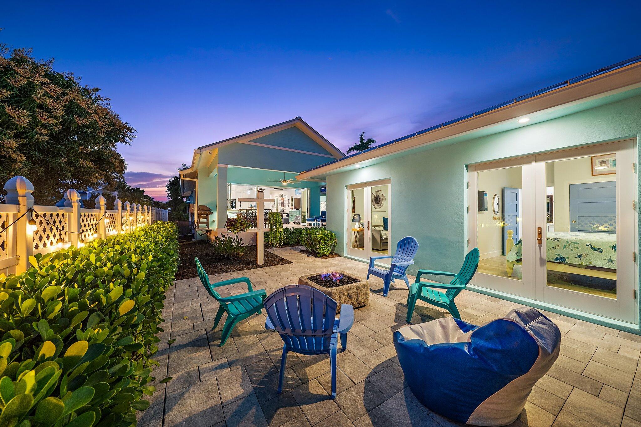 3443 Inlet Court Jupiter, FL 33469 - Photo 14 of 59 3443 Inlet Ct Twilight firepit to house