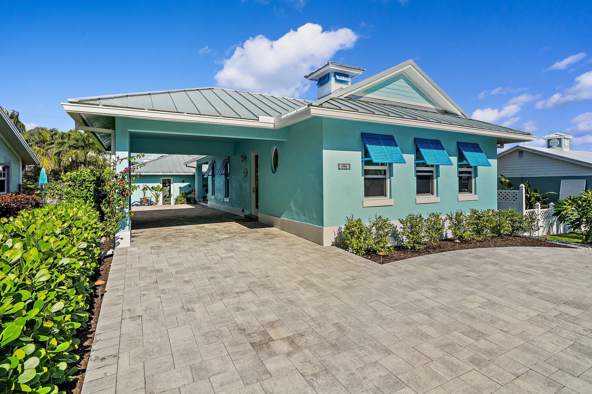 3443 Inlet Court Jupiter, FL 33469 - Photo 16 of 59 a view of a house with potted plants