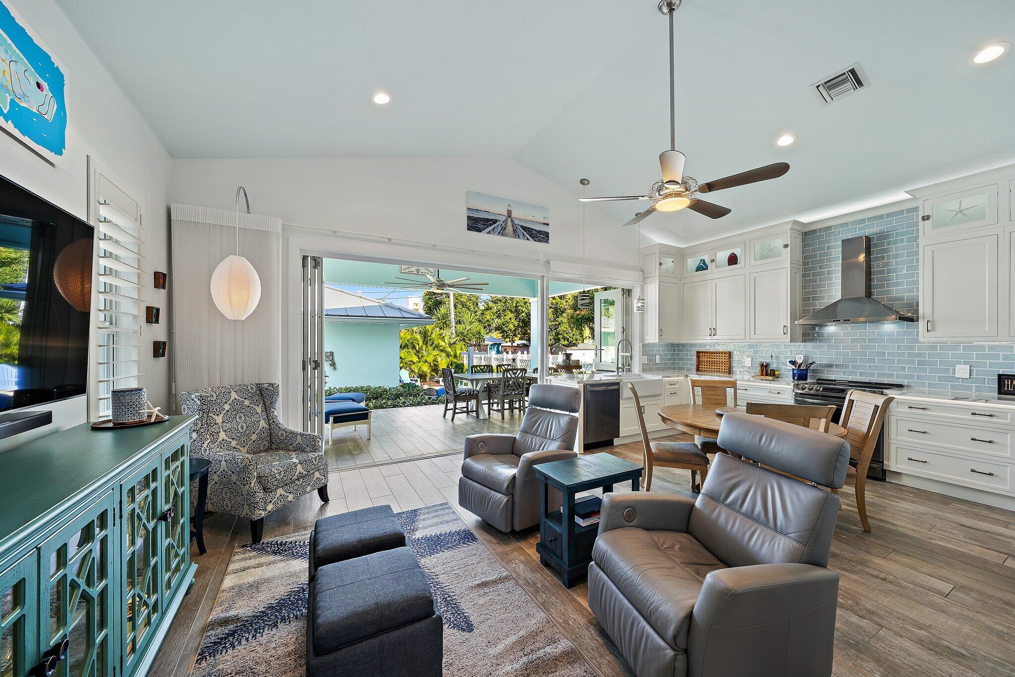 3443 Inlet Court Jupiter, FL 33469 - Photo 19 of 59 a living room with furniture kitchen view and a large window