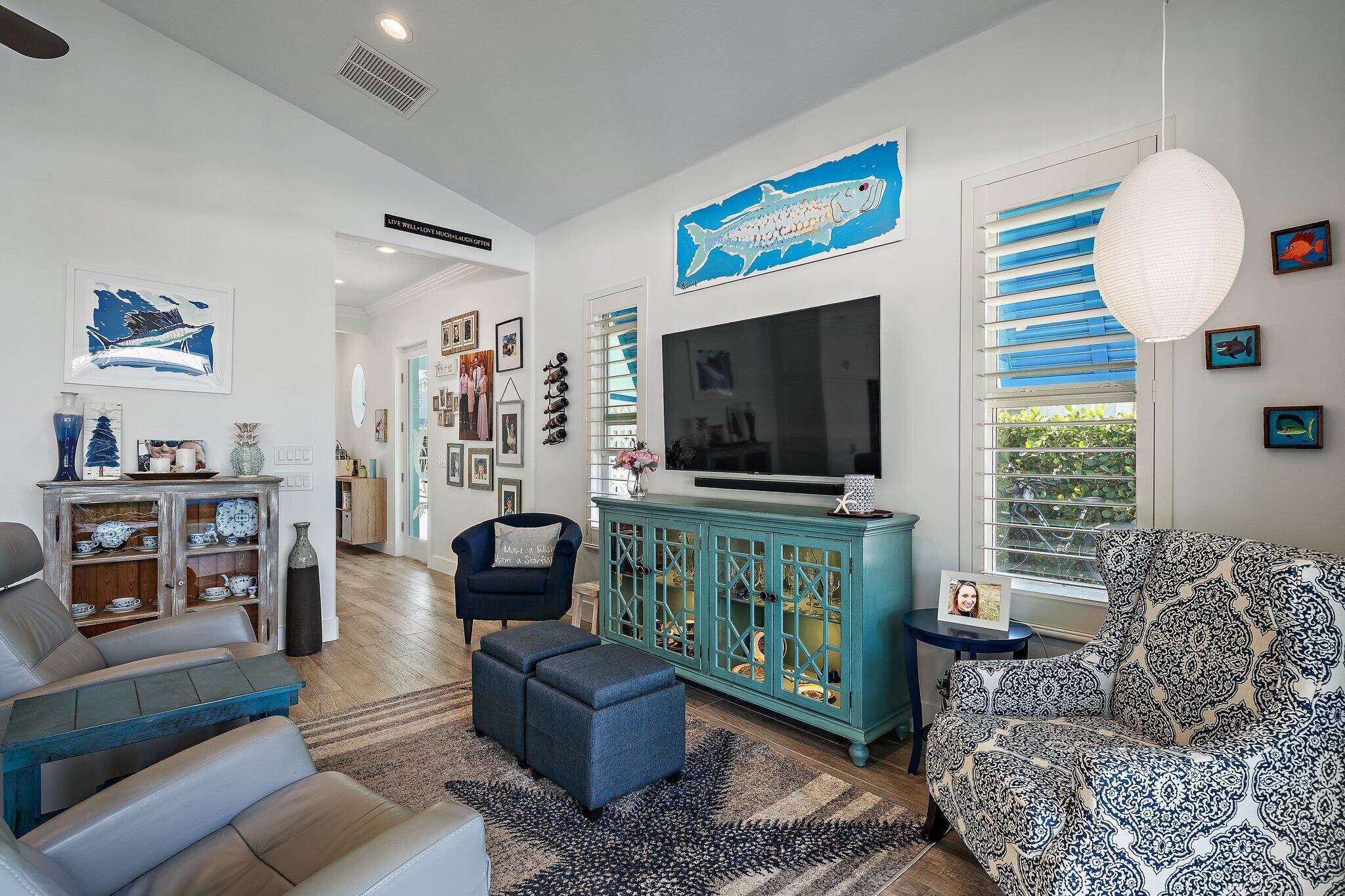 3443 Inlet Court Jupiter, FL 33469 - Photo 22 of 59 a living room with furniture and a flat screen tv