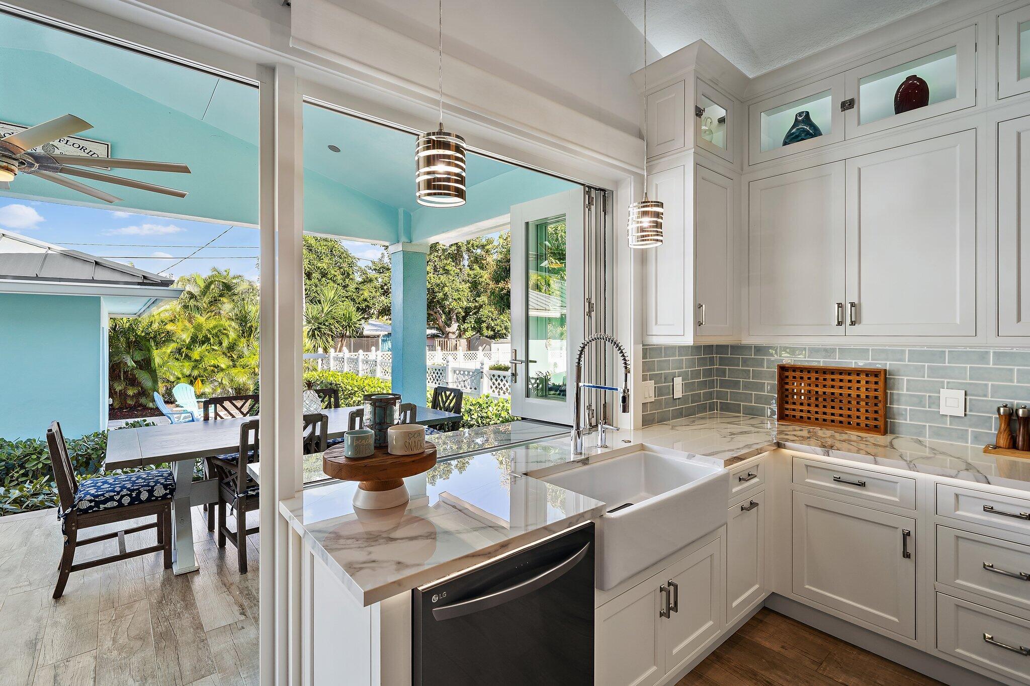 3443 Inlet Court Jupiter, FL 33469 - Photo 26 of 59 a kitchen with a sink stove and cabinets