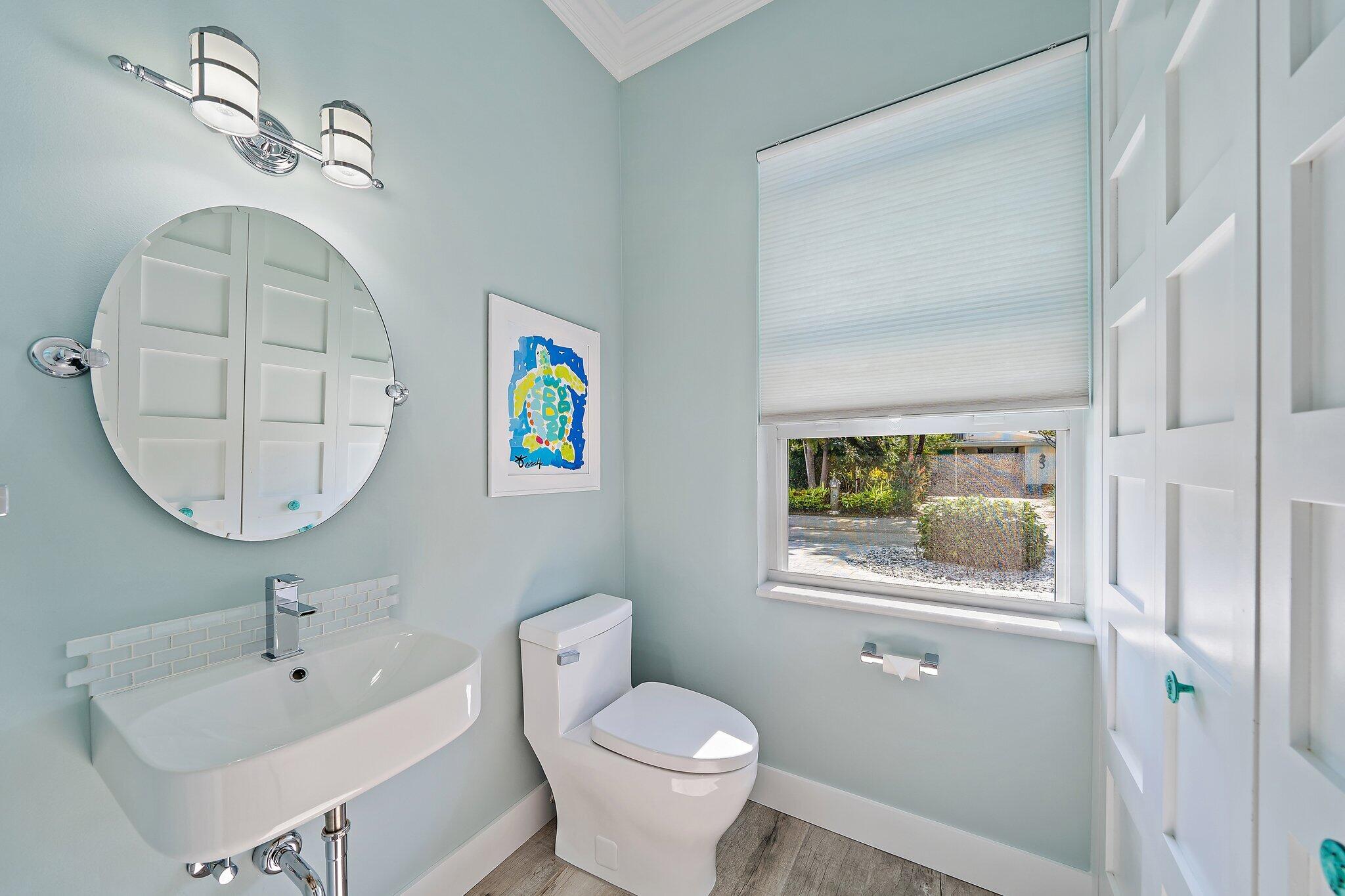 3443 Inlet Court Jupiter, FL 33469 - Photo 30 of 59 a bathroom with a toilet a sink and mirror