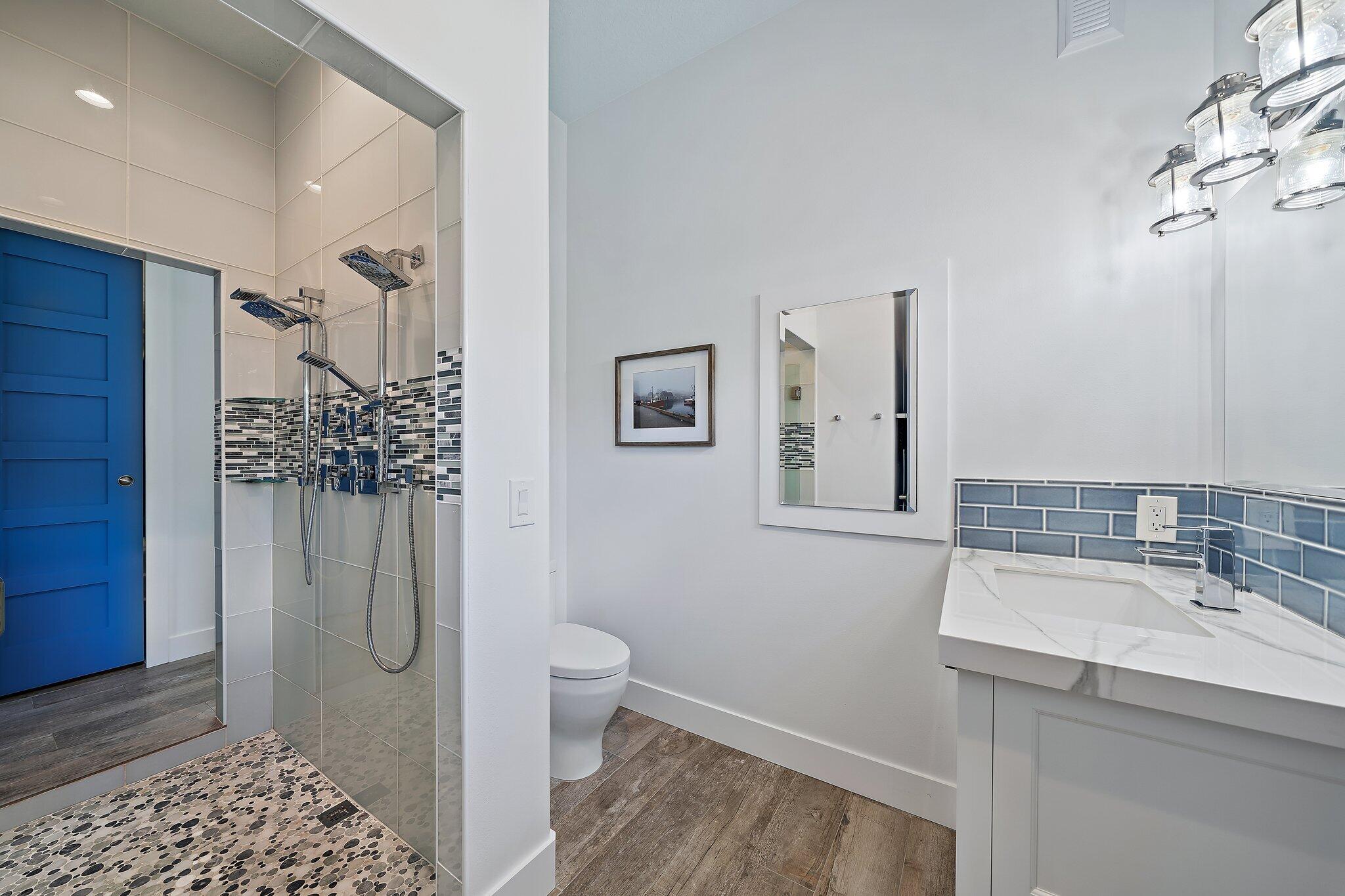 3443 Inlet Court Jupiter, FL 33469 - Photo 35 of 59 a bathroom with a sink a toilet and shower