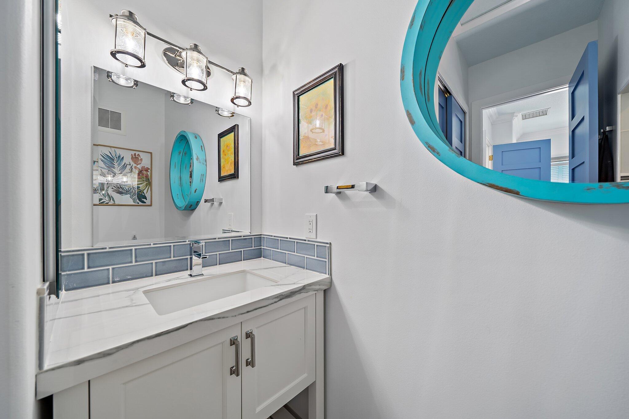 3443 Inlet Court Jupiter, FL 33469 - Photo 36 of 59 a bathroom with a sink and a mirror