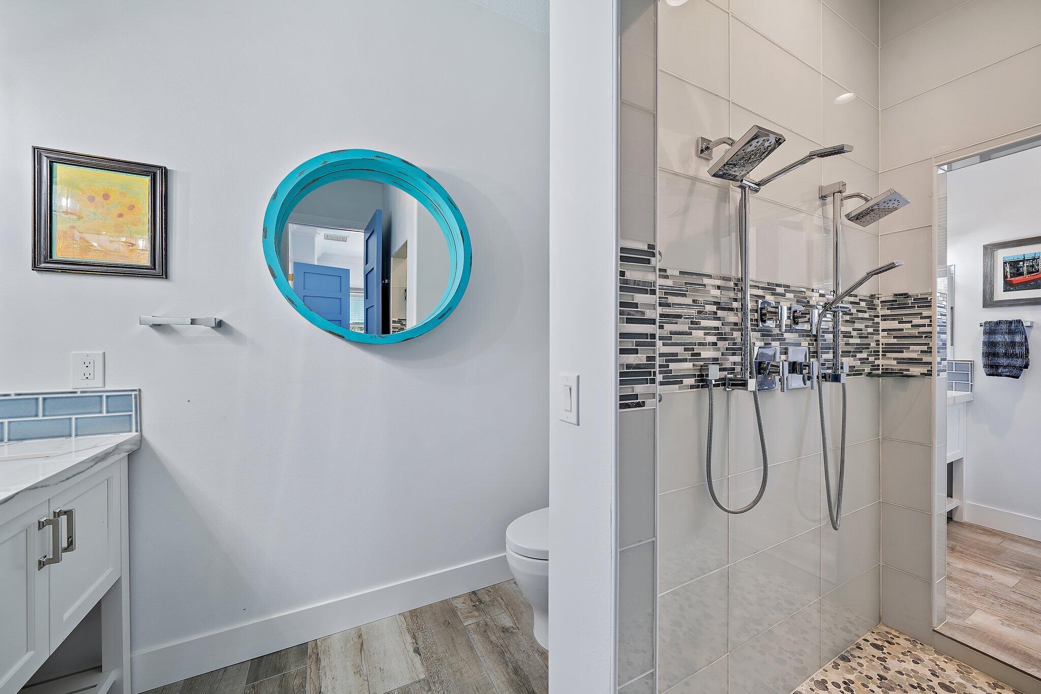 3443 Inlet Court Jupiter, FL 33469 - Photo 37 of 59 a bathroom with a granite countertop shower a sink and a mirror