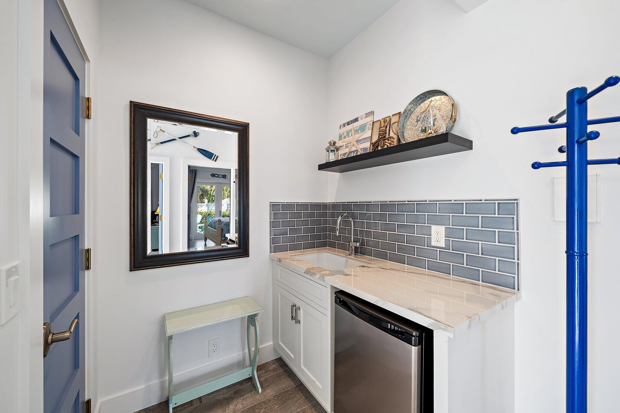 3443 Inlet Court Jupiter, FL 33469 - Photo 47 of 59 a utility room with a sink and a mirror