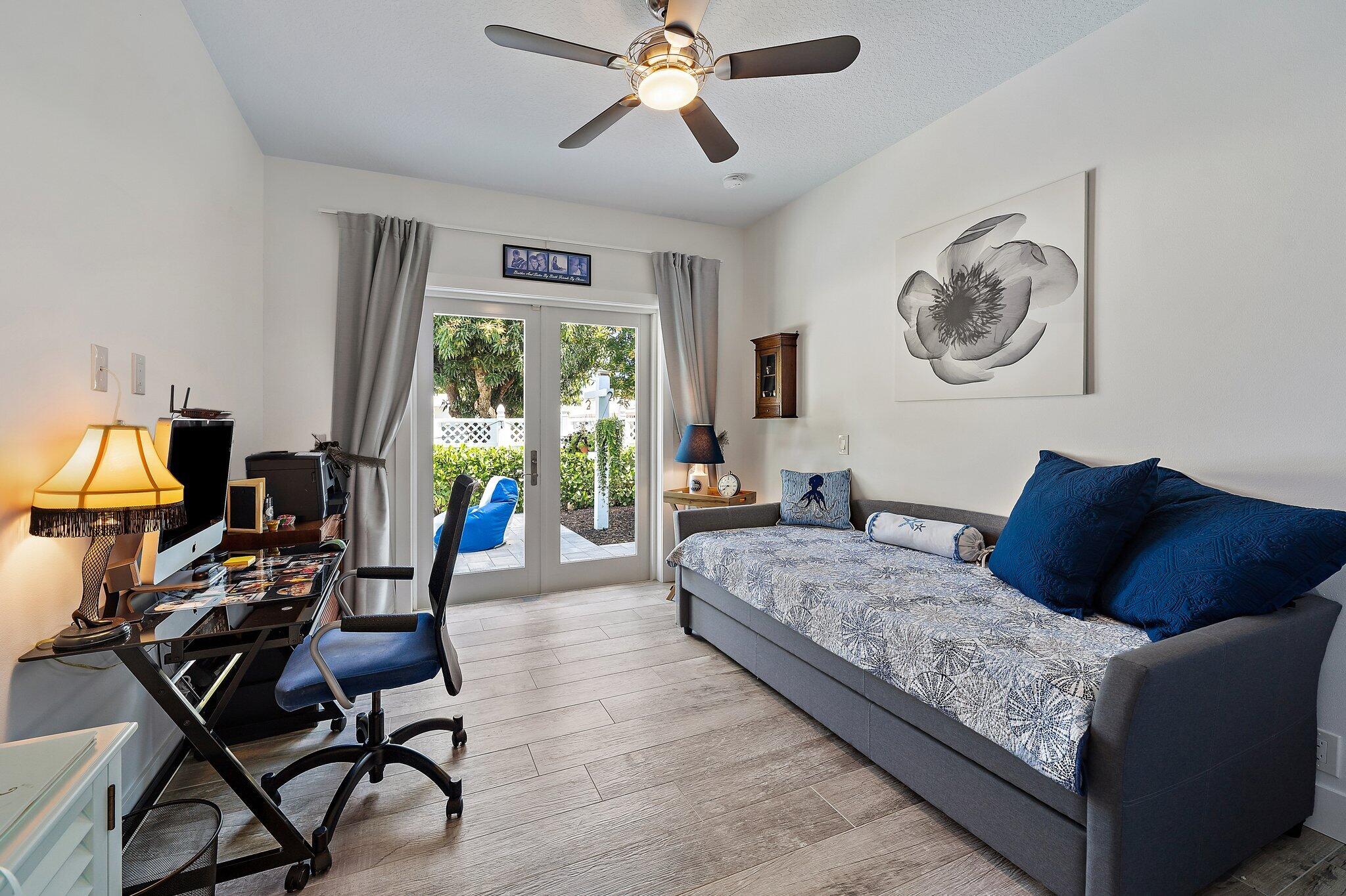3443 Inlet Court Jupiter, FL 33469 - Photo 48 of 59 a living room with furniture and a large window