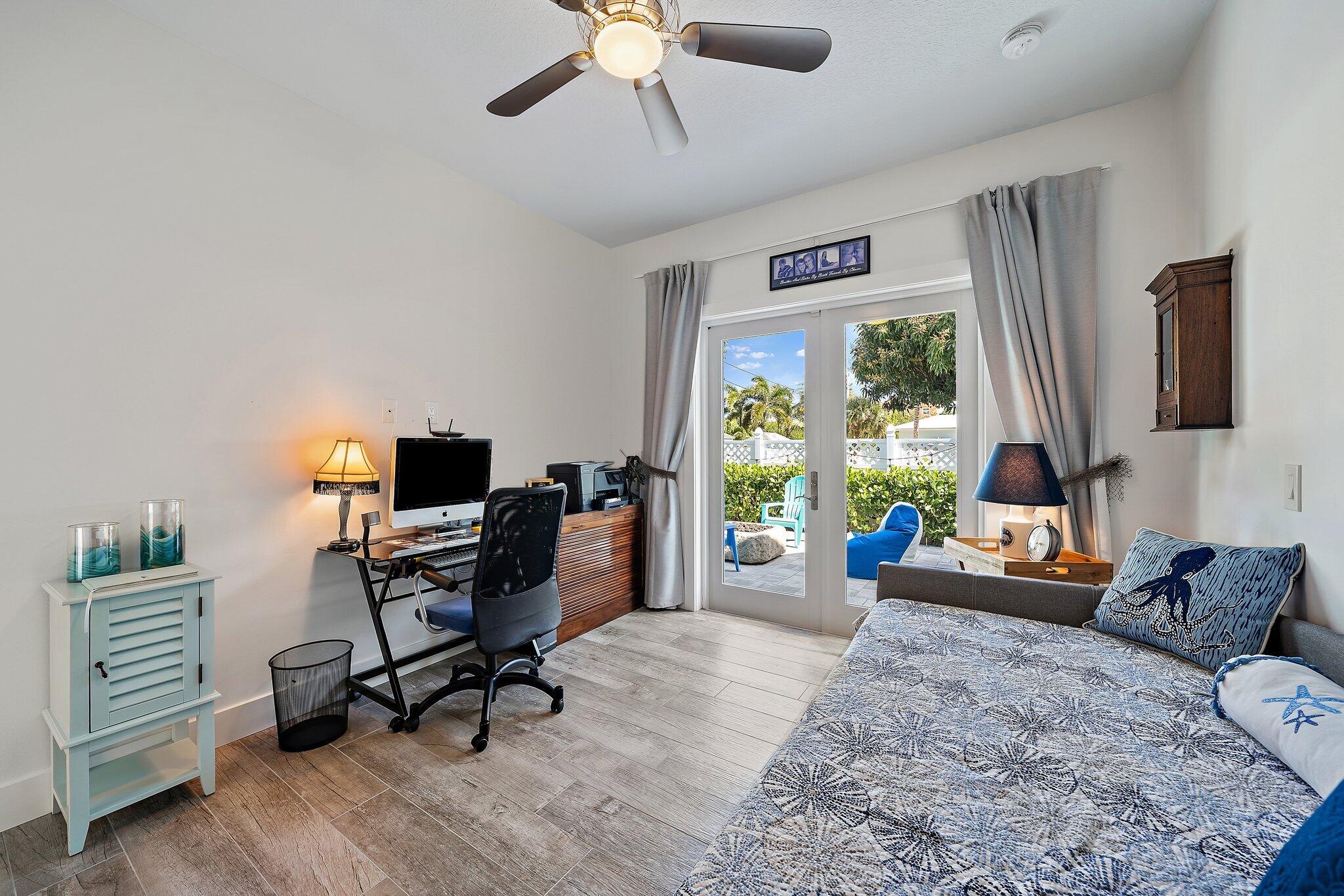 3443 Inlet Court Jupiter, FL 33469 - Photo 49 of 59 a livingroom with workspace and a window