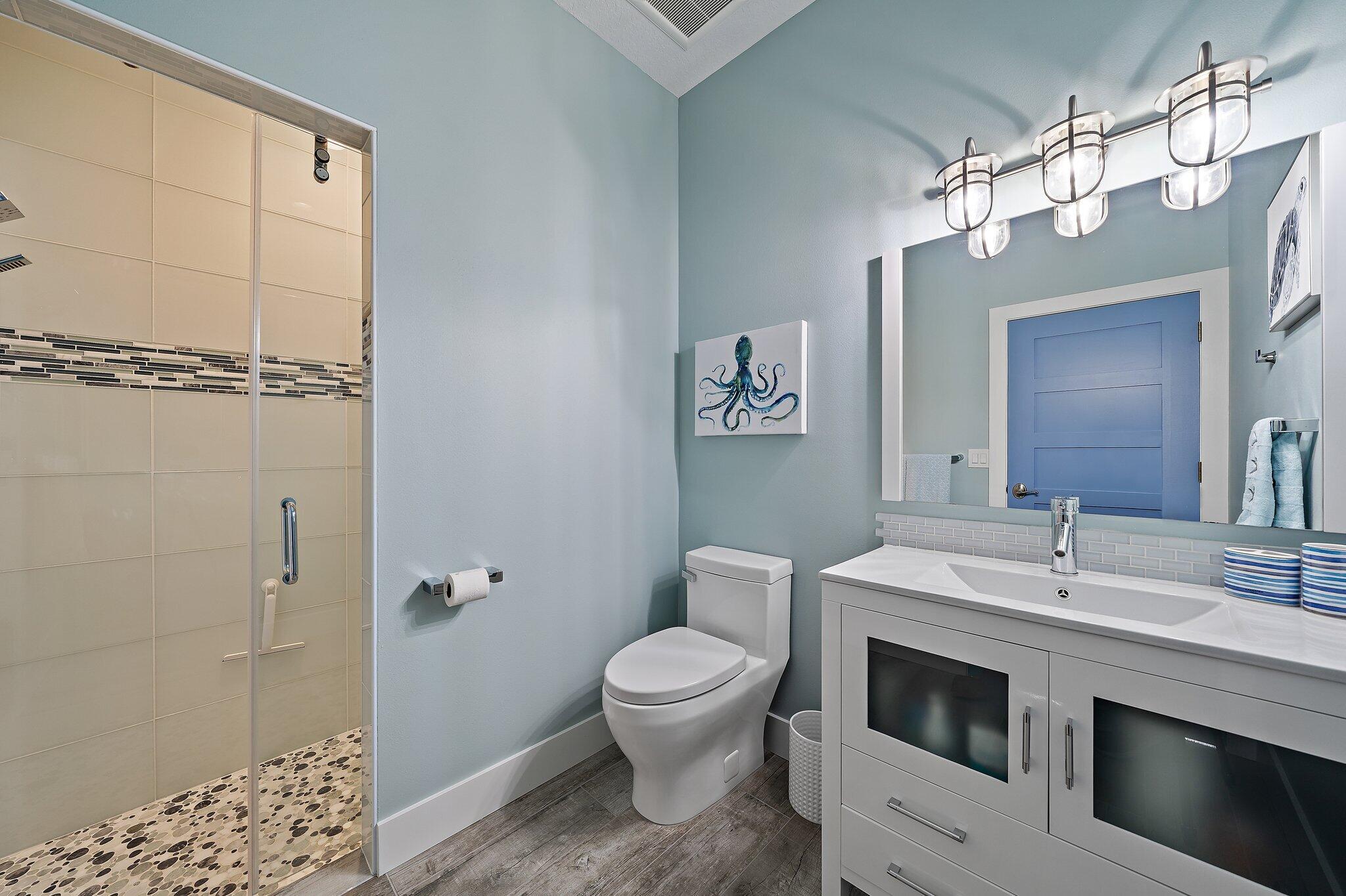 3443 Inlet Court Jupiter, FL 33469 - Photo 52 of 59 a bathroom with a sink a toilet and shower