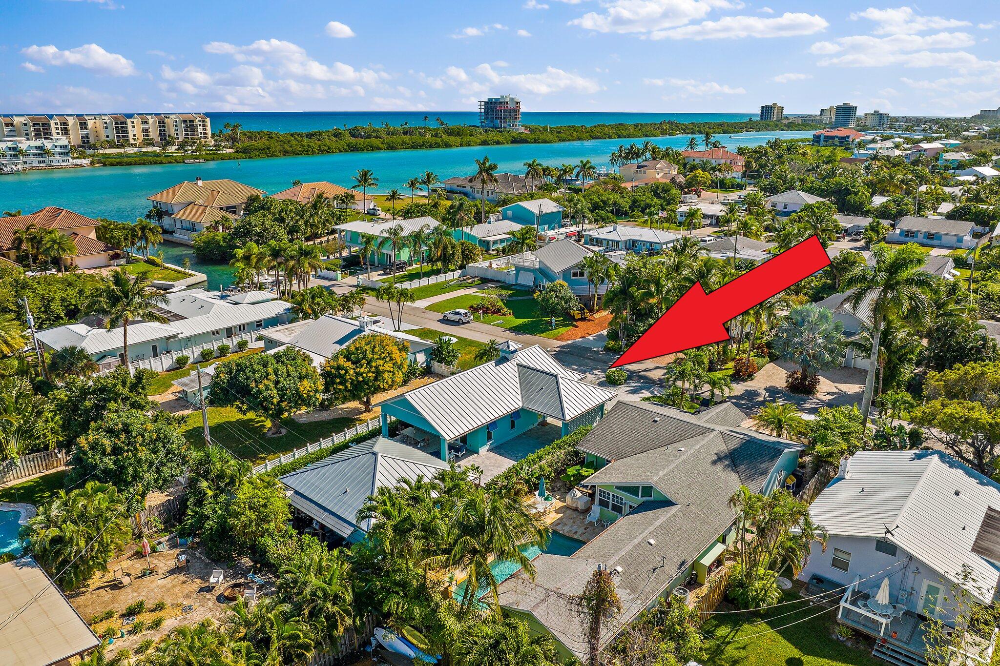 3443 Inlet Court Jupiter, FL 33469 - Photo 54 of 59 an aerial view of a house with a yard and lake view