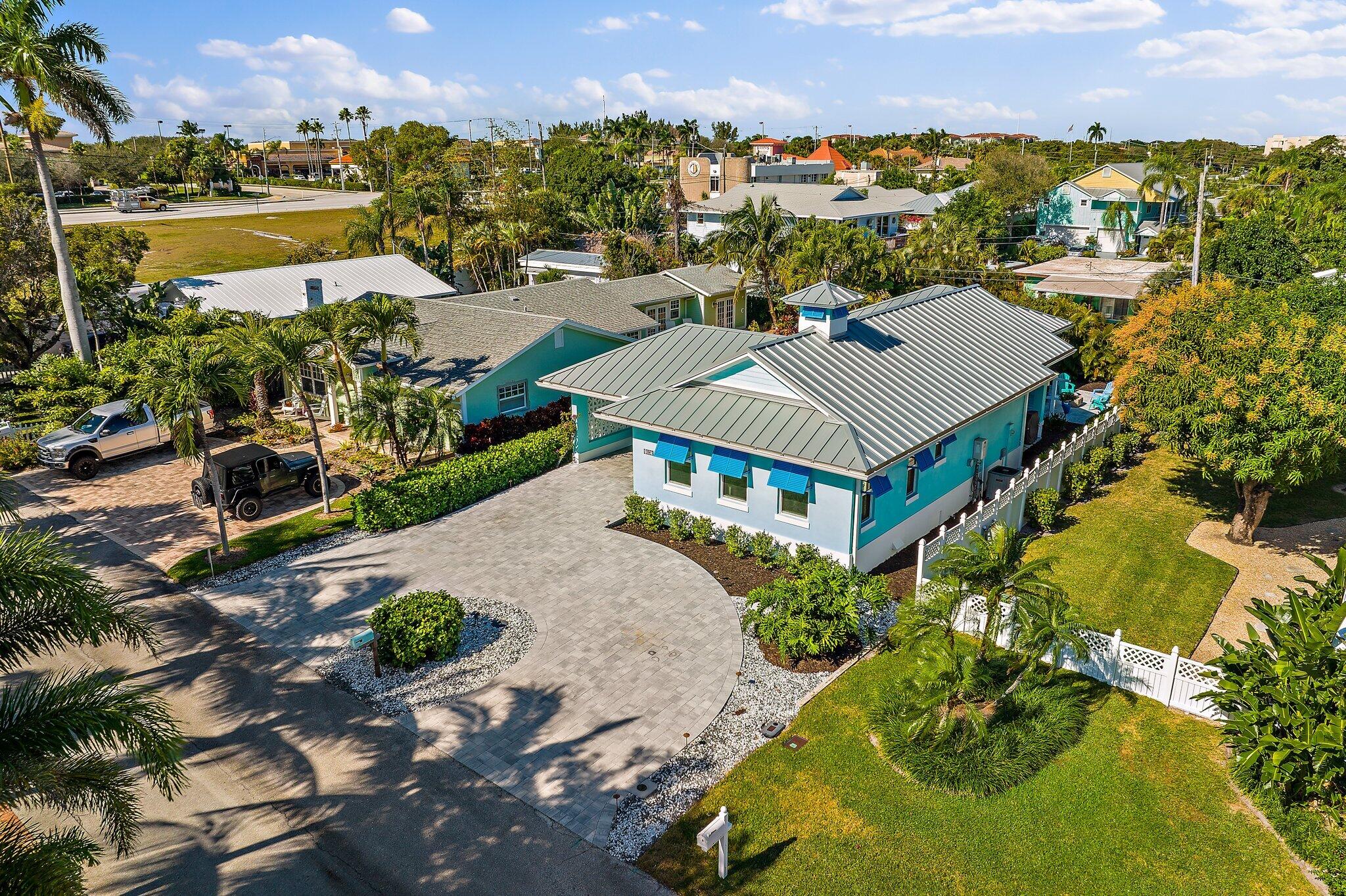 3443 Inlet Court Jupiter, FL 33469 - Photo 58 of 59 an aerial view of residential houses with outdoor space and river